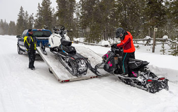 Transporting your snowmobile using a tilt bed trailer